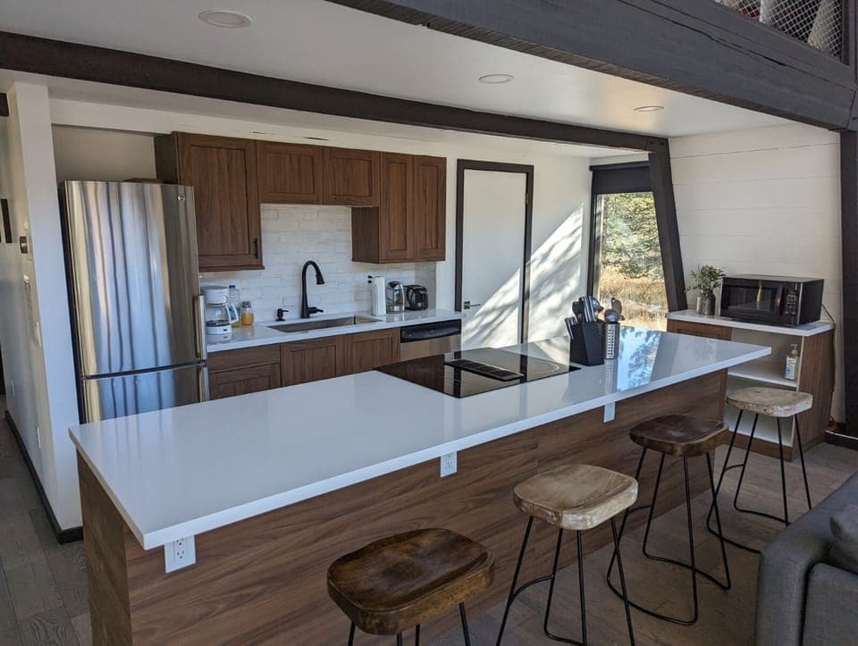 Remodeled fully stocked kitchen with breakfast bar 
