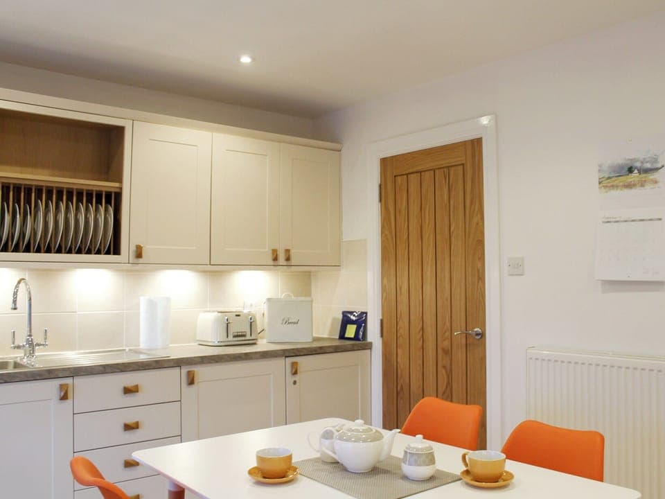 Well equipped kitchen/ dining room | Rhunahaorine Cottage, Tayinloan, near Tarbert