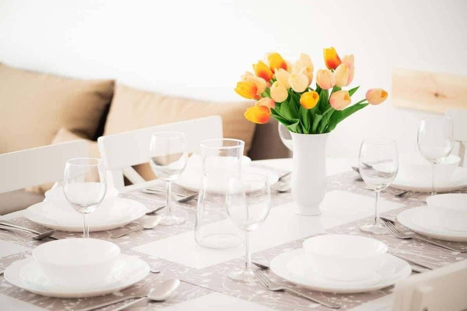 A stylish dining table with chairs, which is ideal for family meals or remote work.