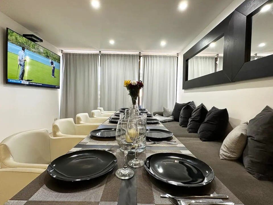 Welcome to Entertaining Modern Living! Gather in this spacious Dining & Bar