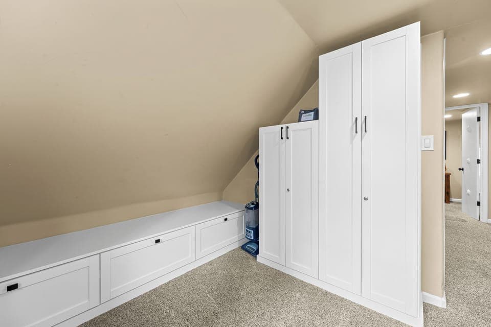 Upstairs loft with small seating/play area.