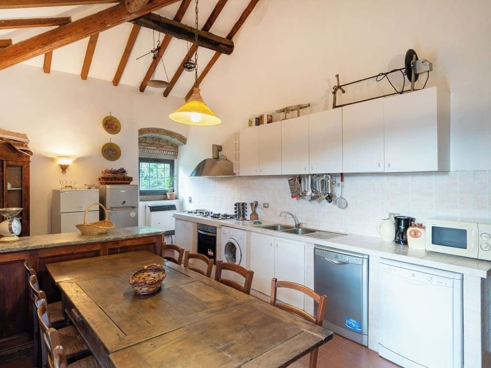 Countertop, Cabinetry, Property, Wood, Kitchen, Kitchen Appliance, Interior Design, Kitchen Stove, Architecture, Flooring