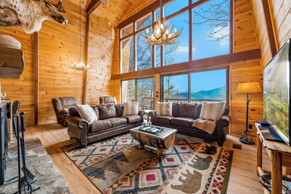 Living room has two story windows with stunning views of the Smoky Mountains!