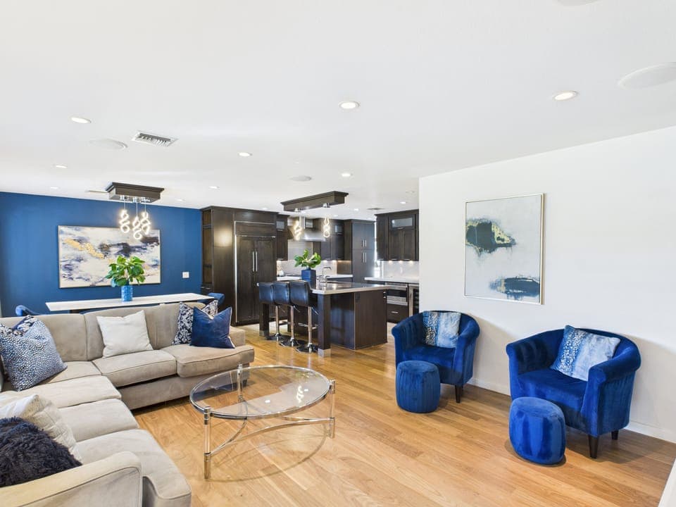 Bright and open living area featuring cozy furnishings, and a Smart TV.