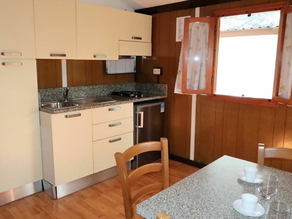 Room, Countertop, Property, Furniture, Kitchen, Cabinetry, Building, Kitchen Stove, Floor, Major Appliance