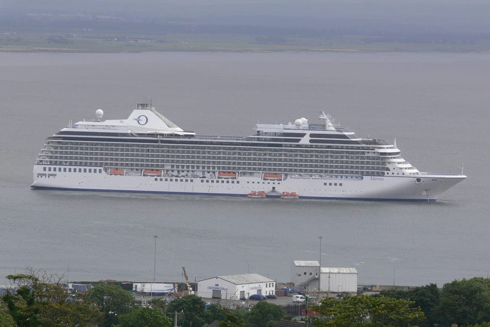 CRUISE SHIP ANCHORED OFF THE HARBOUR