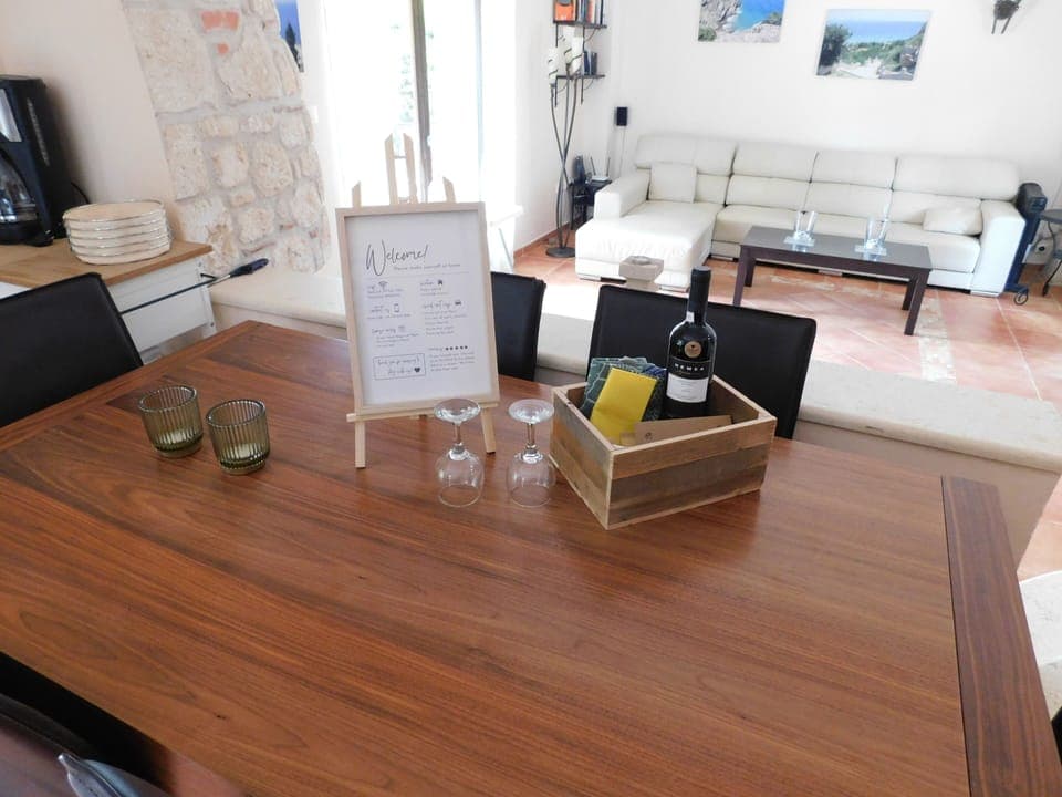 Indoor dining table with lounge area behind