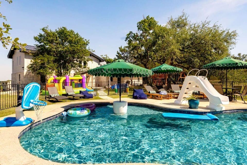 The center of the Retreat, the pool offers ample seating for adults and fun for kids with a beach entry.