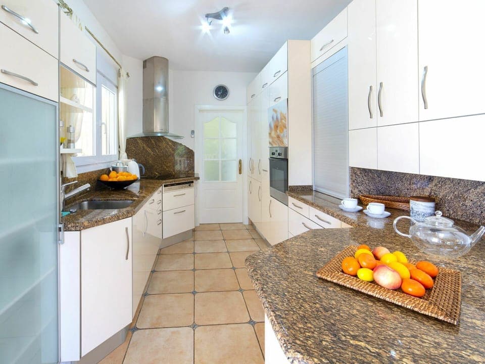 Countertop, Room, Property, Yellow, Kitchen, Interior Design, Tile, Furniture, Floor, Building