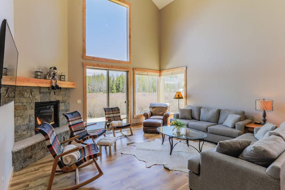 Open layout with high ceiling make this living area relaxing with lots of natural light