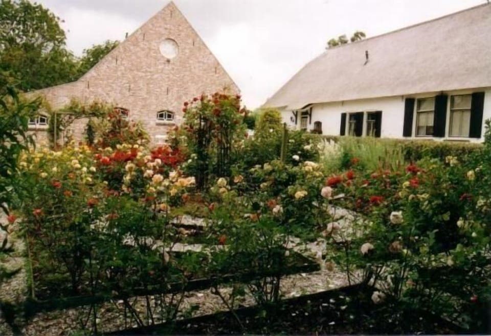 External view of the building. Farmershouse, apartment and rosegarden