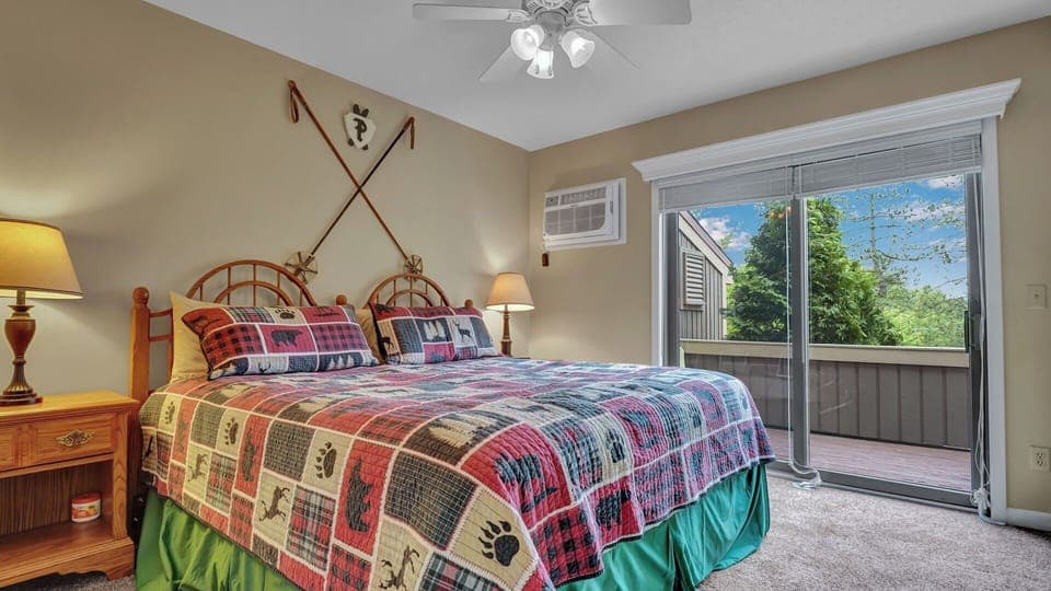 Bedroom with king bed with access to back deck