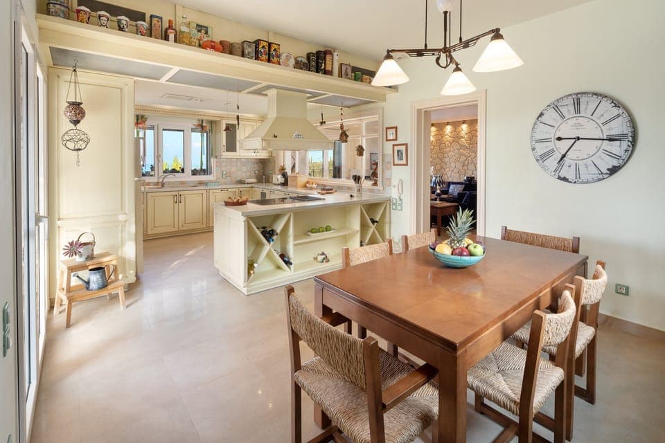 The full kitchen and indoor dining area with an expandable table