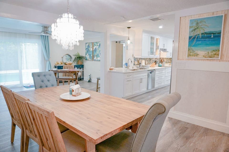 Spacious open plan area.  The Dining table has 5 chairs and a bench - seats 8