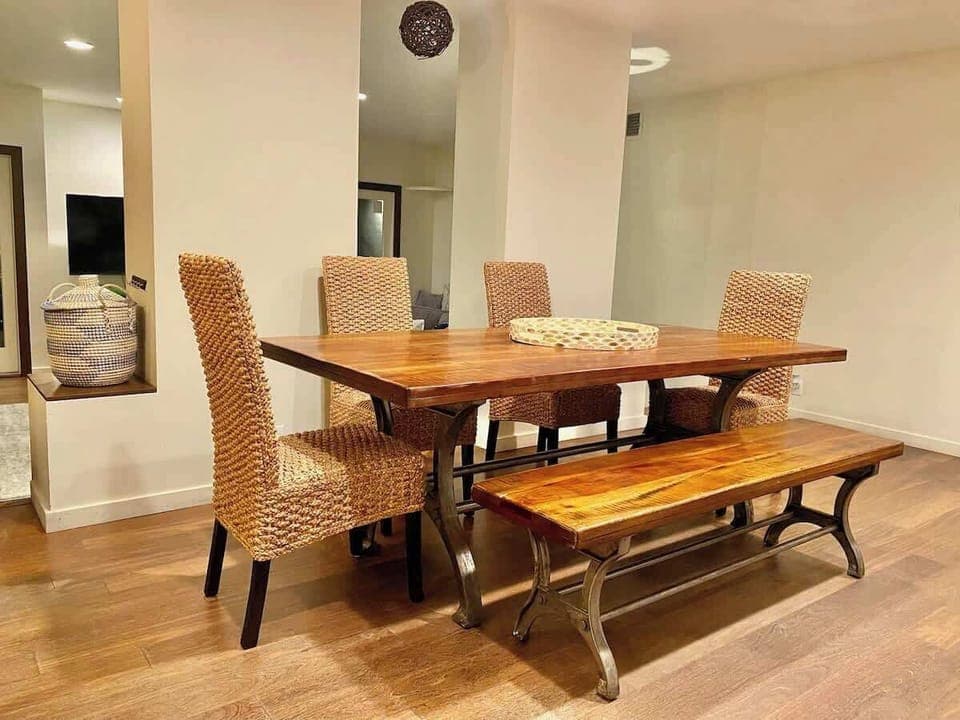 Elegantly designed living and dining room. Dining table has extra bench now and seating for at least 6 people 