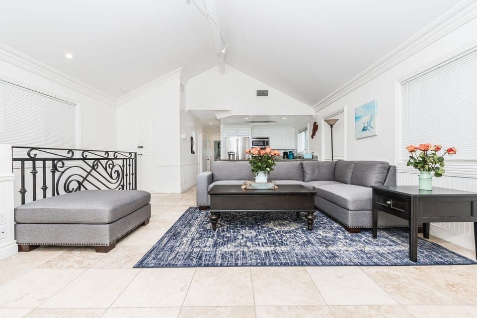 Modern and warm, with 2 levels and 2 living rooms, this oceanfront rental is the perfect home base for a trip to the beach.
                