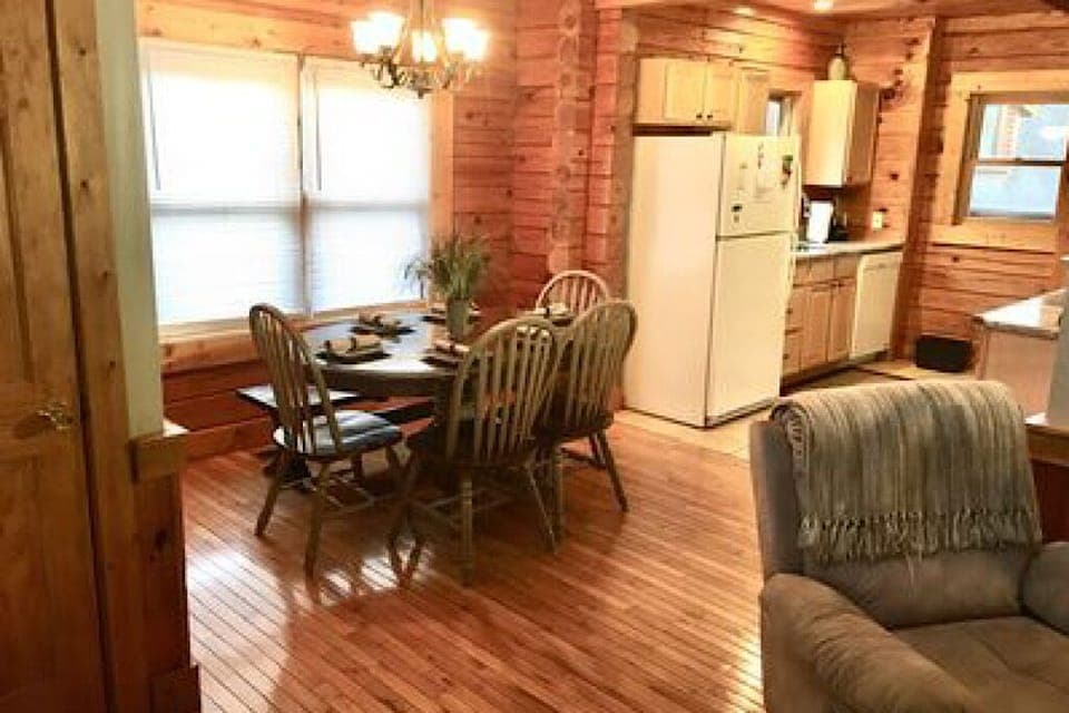 Main level living room opens to dining area and galley kitchen 