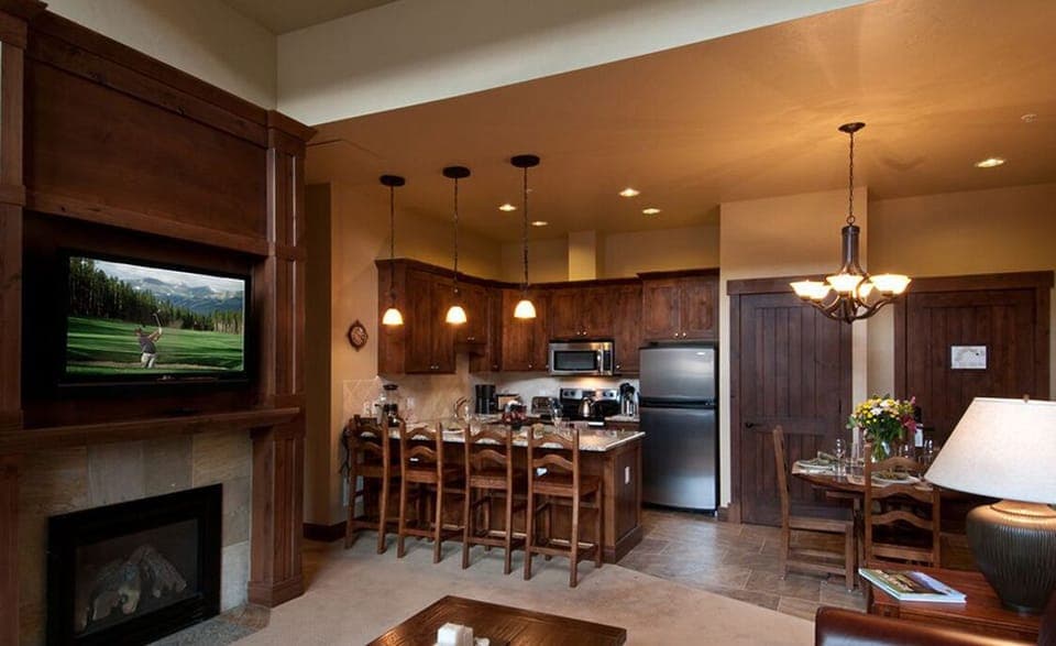 Master unit kitchen with seating for 4.  Fireplace and big screen.  