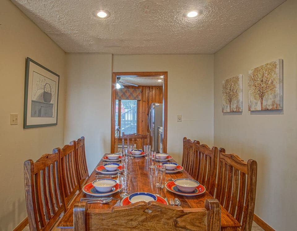 The dining room is located off of the kitchen and living room. The table has seating for 8.