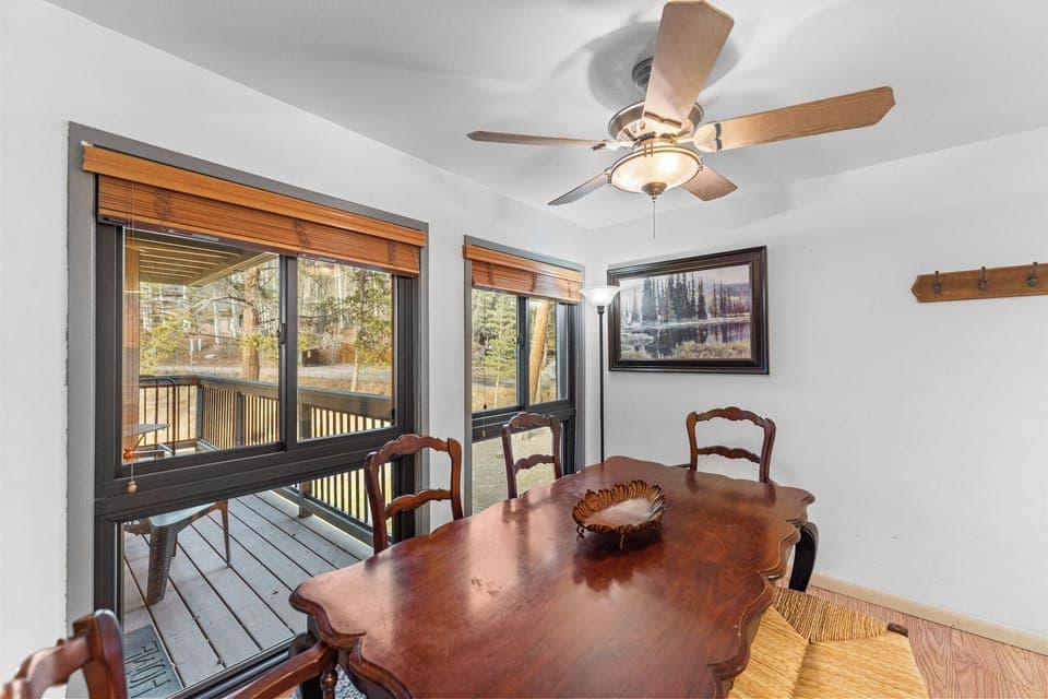 The dining area is just off the deck for a bright feel with beautiful views.