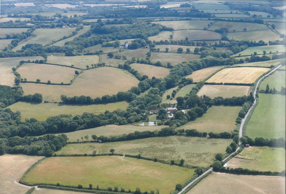 Aerial view of Woodland Cottage and its stunning rural location