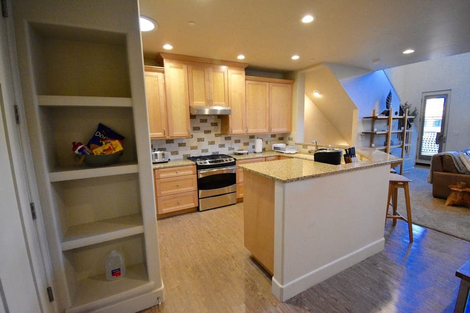 Bright convenient, fully equipped kitchen with open format.