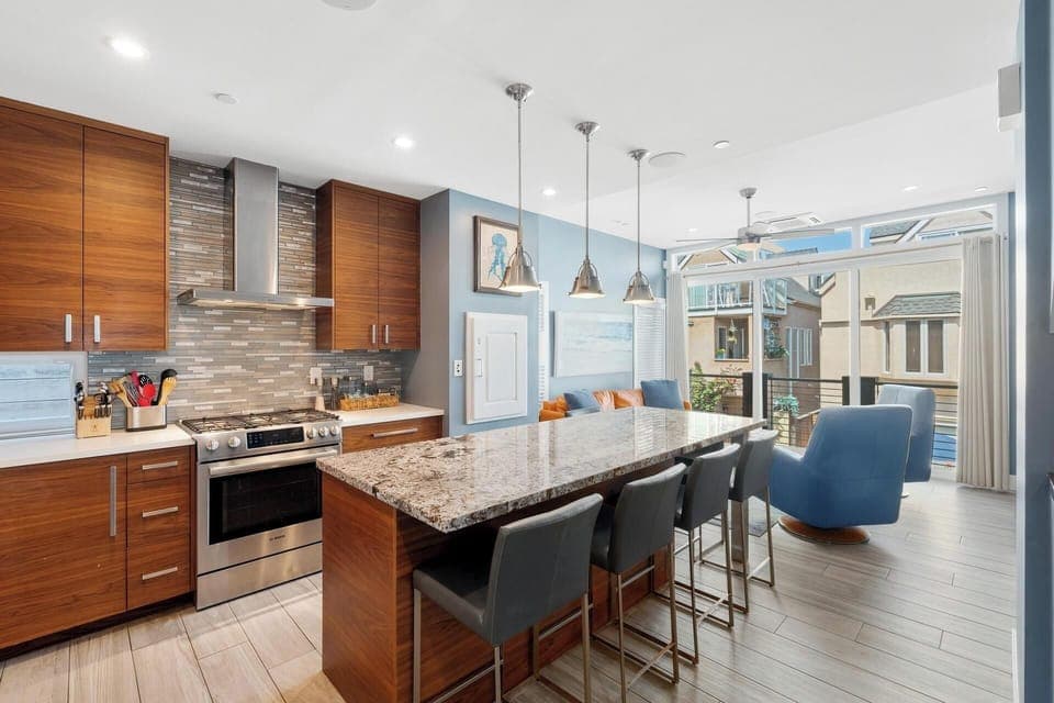 Stainless steel appliances and plenty of kitchen utensils for dining in.