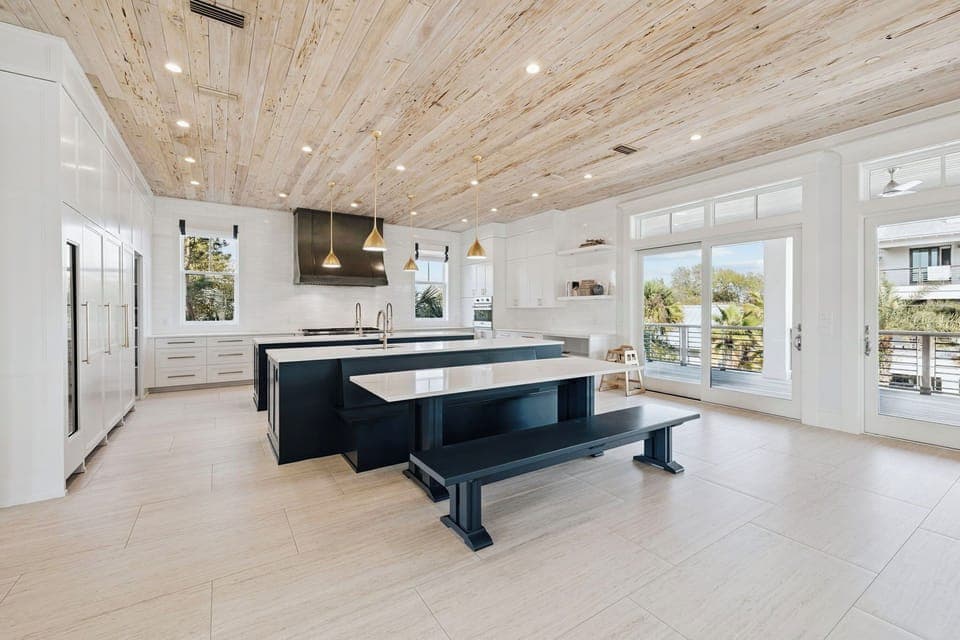 You'll love cooking in this stunning gourmet kitchen with its spacious island, sleek appliances, and beautiful wood ceiling that adds warmth to your culinary adventures.