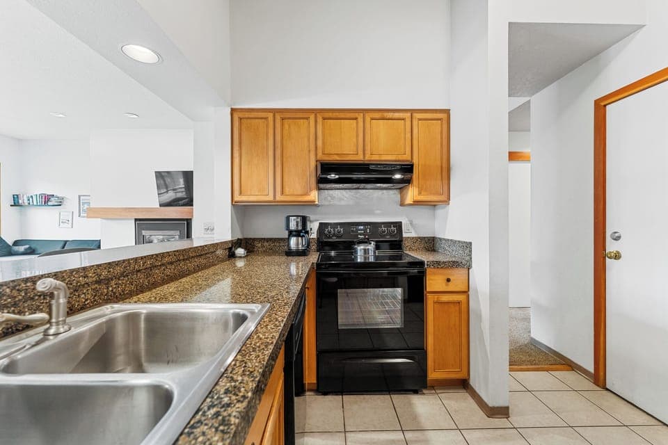 Full size kitchen with granite countertops.