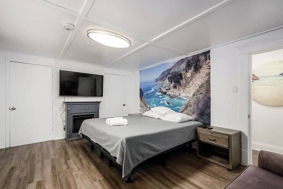 Master bedroom includes king smart/automatic bed, large 4k smart tv, and work desk.