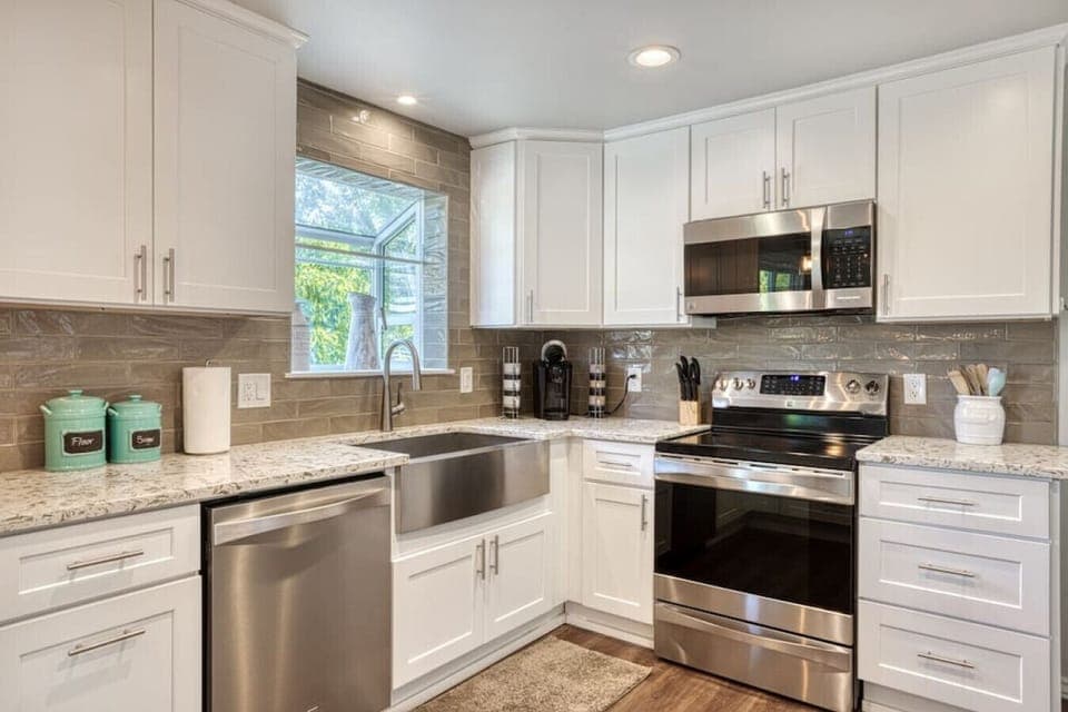 Fully updated kitchen boasting stainless steel appliances, ample counter space, and all the essentials needed to prepare delicious home-cooked meals