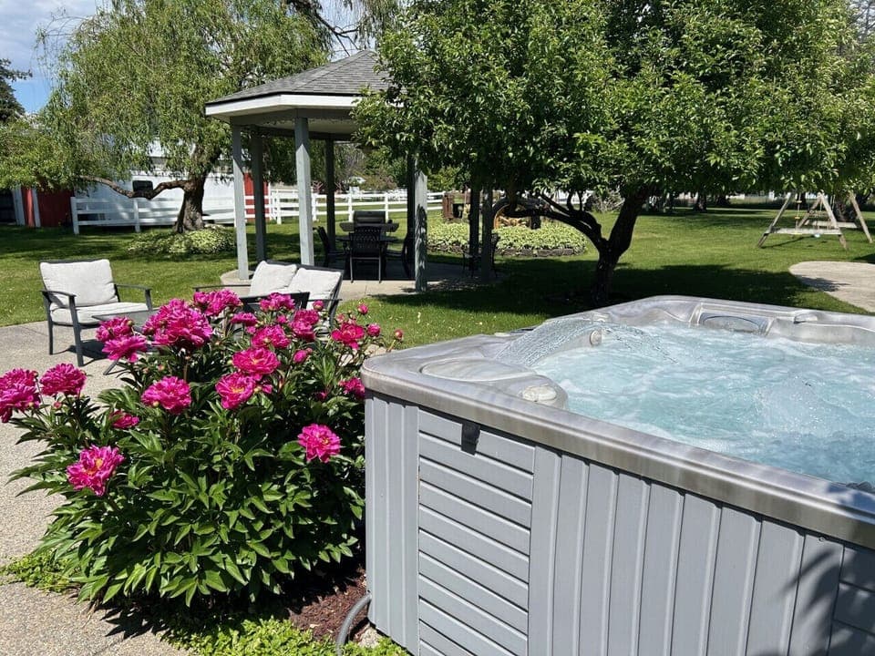 Unwind in the outdoor hot tub, offering a perfect way to relax under the stars after a day of adventure