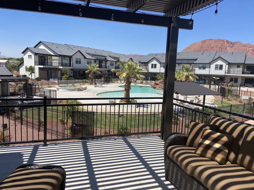 Deck with great view of red mountains and pool area