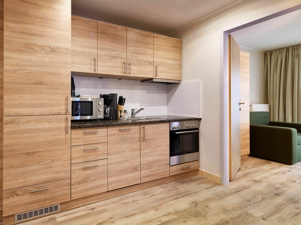 Cabinetry, Countertop, Furniture, Kitchen Appliance, Kitchen Stove, Interior Design, Wood, Kitchen, Building, Home Appliance