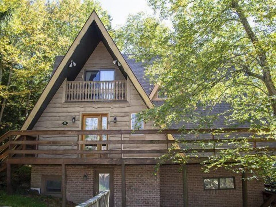 A view of the home from the hot tub. The bottom door is on the basement level and leads out to the hot tub.