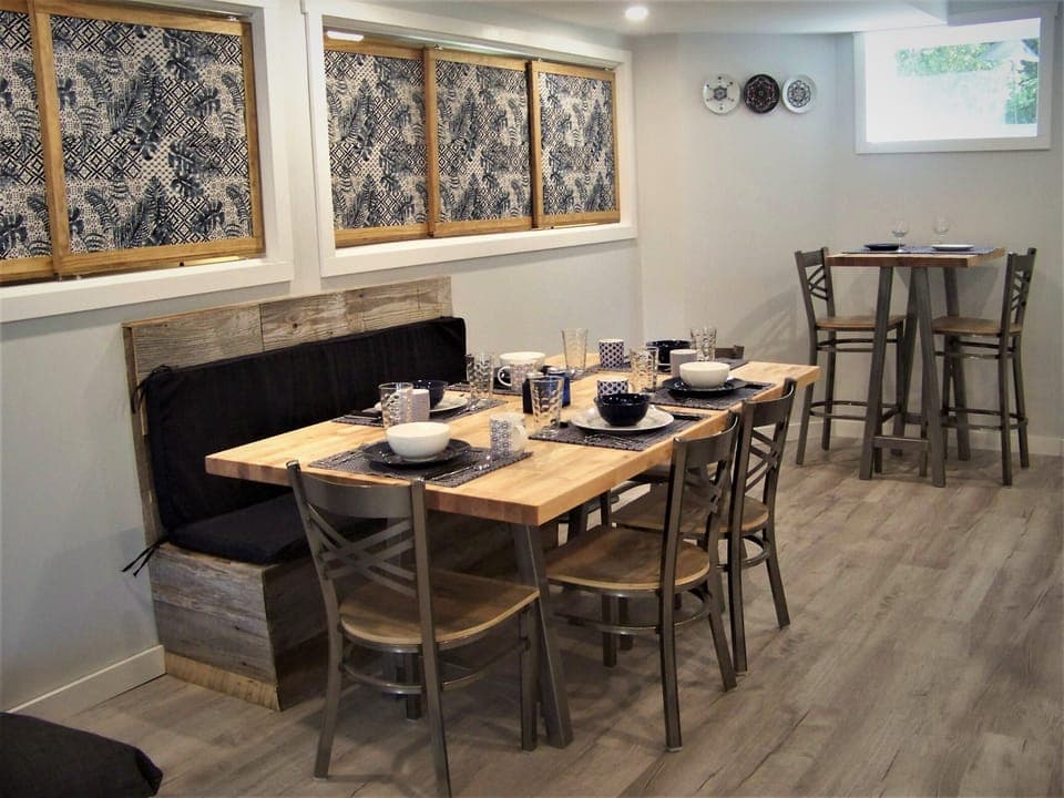 Butcher block tables and seating for eight.
