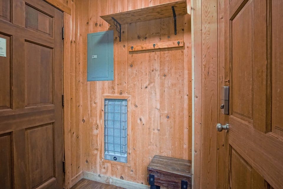 Entry way to the townhome, storage area for ski equipment just inside the front door