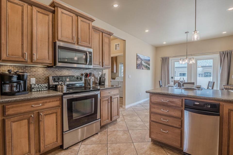 Fully equipped kitchen with high-end appliances, perfect for home-cooked meals.