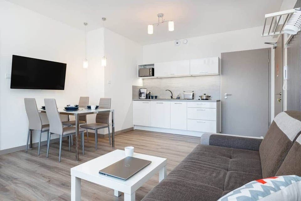 Living room of Pięć Mórz Lotnicza 1I/20 apartment with sofa