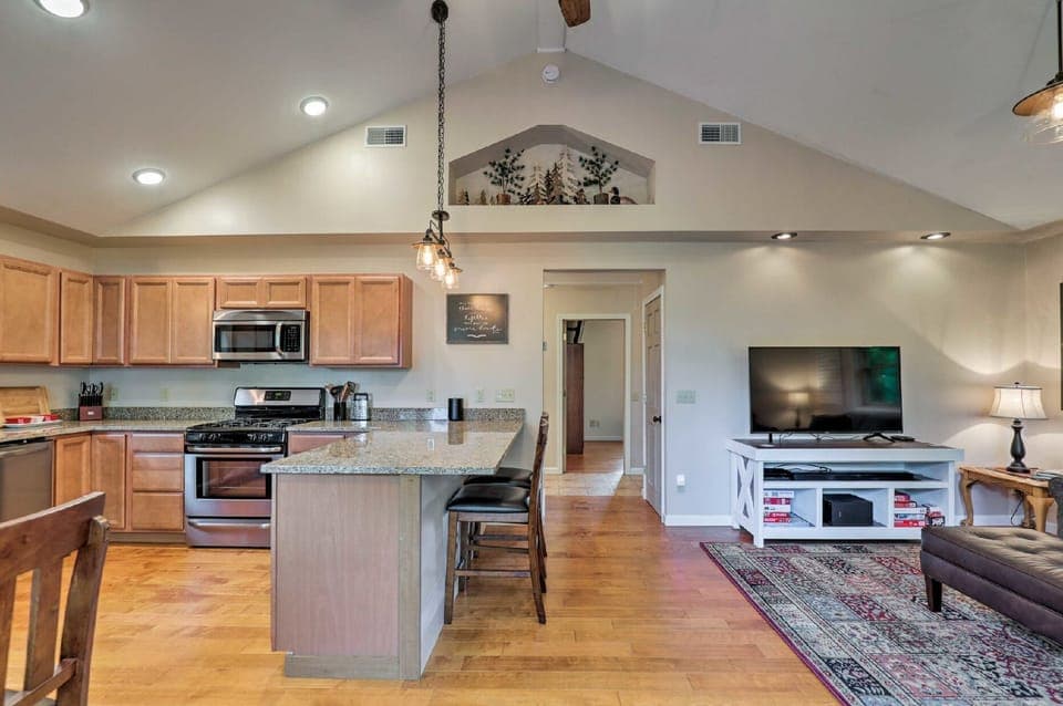 Living/dining rooms, 13' ceiling, large fan. It's open and airy yet super cozy.