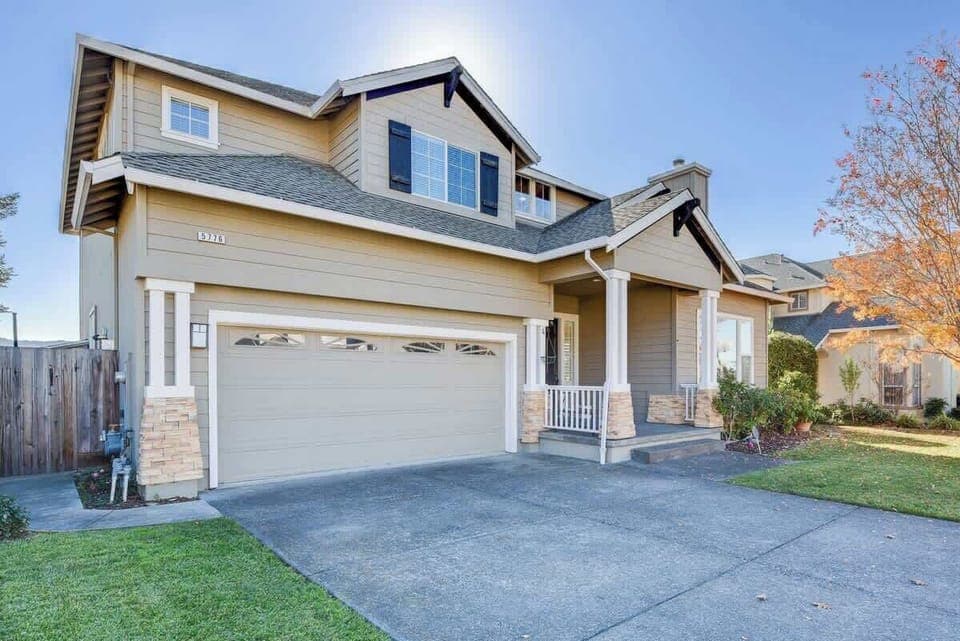 Warm and inviting exterior with lovely landscaping and a cozy front entry—perfect for a comfortable stay.
