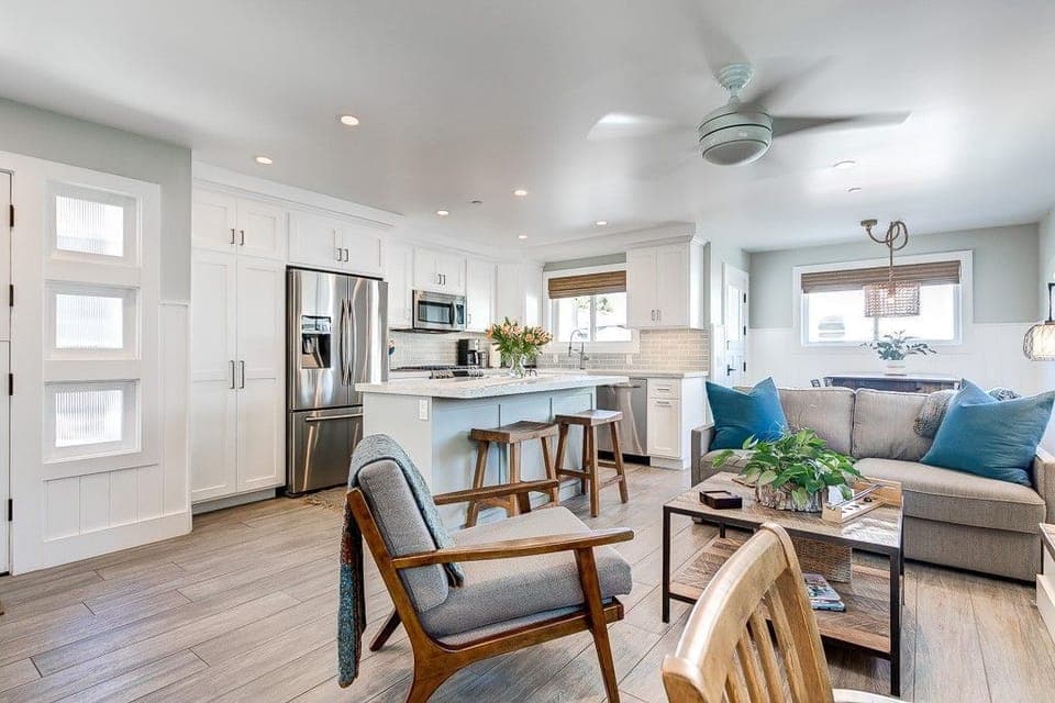 The kitchen opens seamlessly into the living and dining area for easy group hangouts.
                