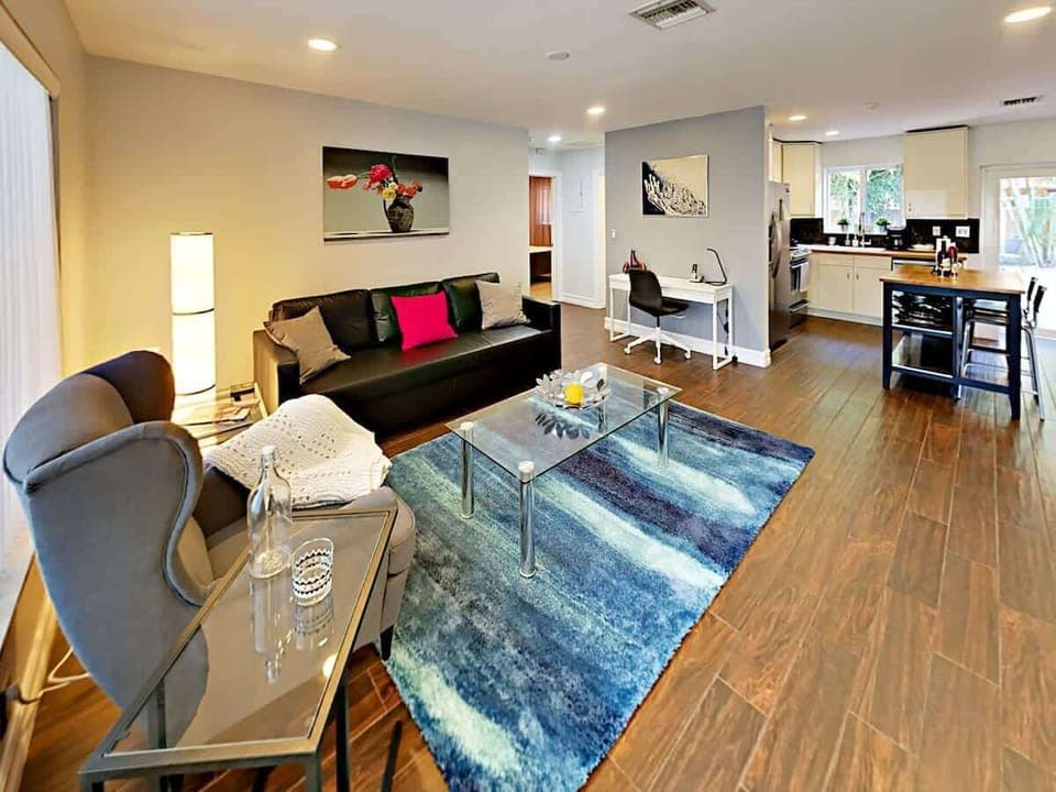 Relax and unwind in the spacious living room on the inviting sofa and reading chair 