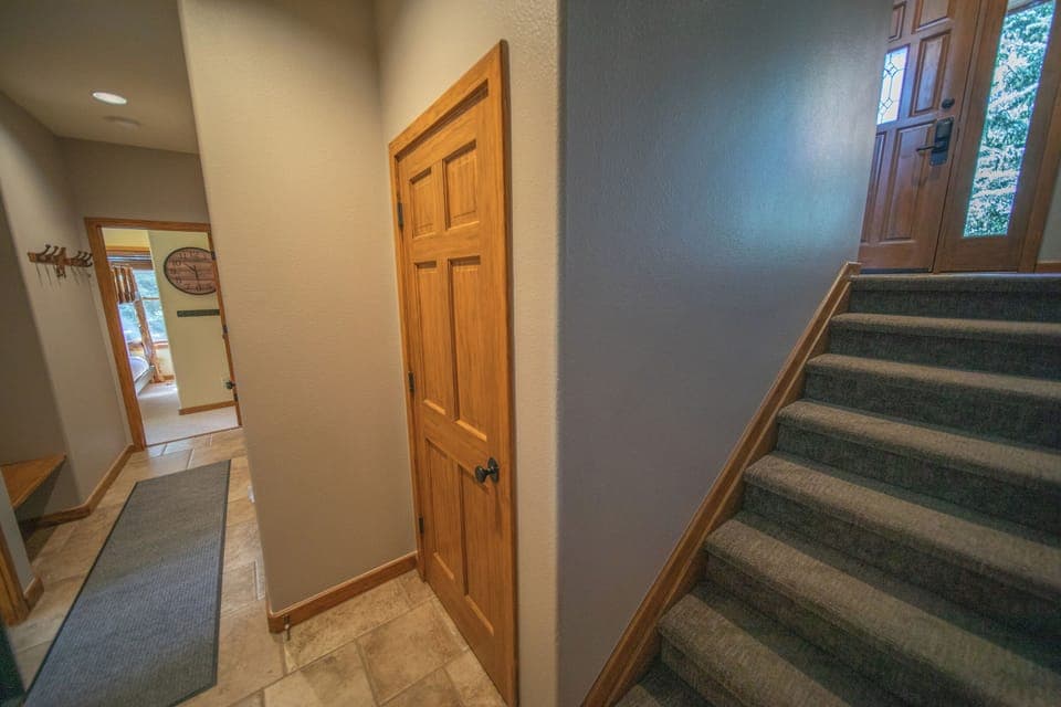 Hallway to downstairs bedrooms and game room!