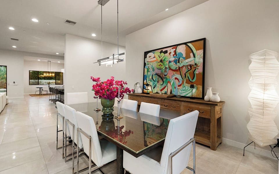 Elegant dining room with natural light from large sliding doors
