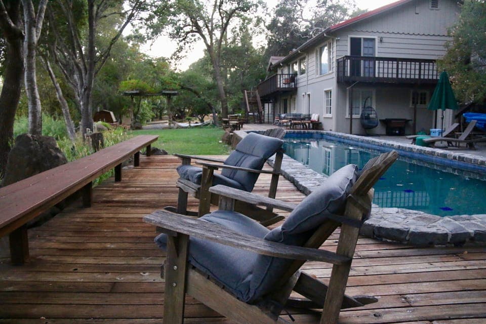 Riverside pool and multiple seating areas