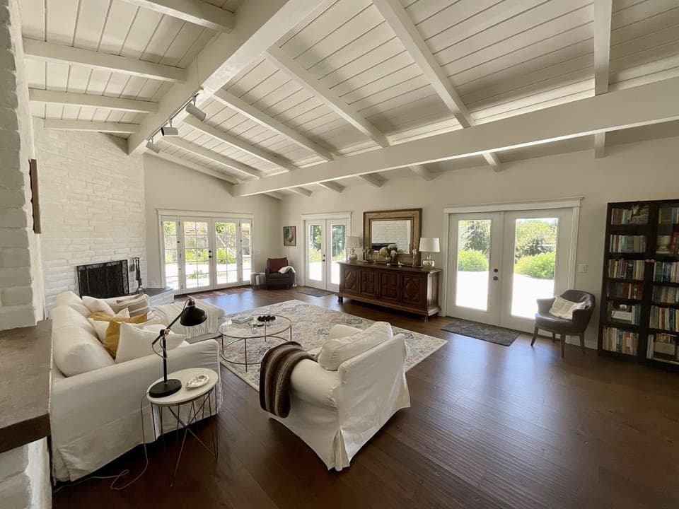 Living Room with wood burning adobe fireplace