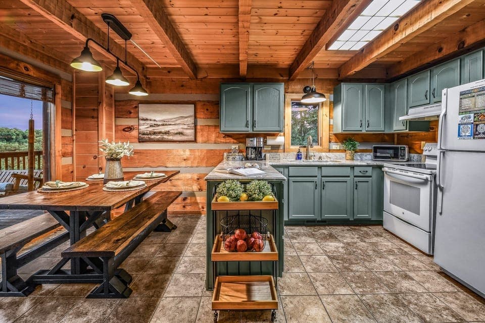 Features modern appliances, custom cabinetry, and a large farmhouse dining table for group meals.