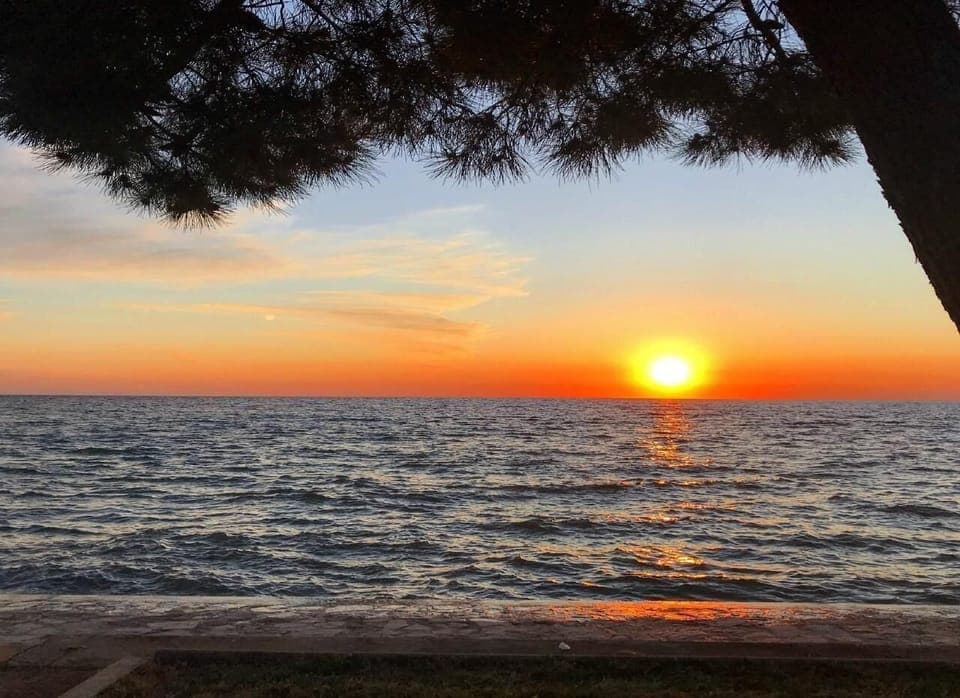 The beautiful sunset as seen from the beach of Villa Rita