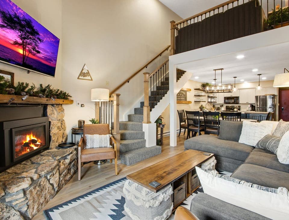 Warm up by the fire, relax and put your feet up on a pouf.  Stairs lead to loft.